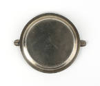 Bottom of round silver ashtray