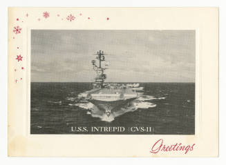 Holiday card with red snowflakes and “Greetings” at bottom right corner, the card frames a blac…