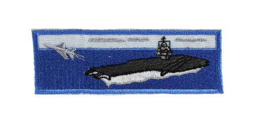 Blue embroidered liberty cuff patch depicting an aircraft carrier at sea with an airplane flyin…