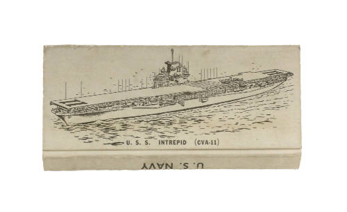 Front of recommissioning matchbook box with image of the aircraft carrier USS Intrepid at sea