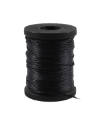 Black wooden spool with navy blue sewing thread