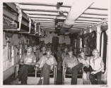 Black and white photograph of pilots seated in the ready room