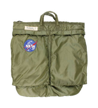 Green bag with carrying handles, front pockets, a patch with the name "Truly" and a insignia NA…
